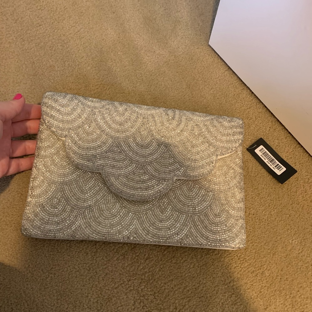 Lulus clutch with tags